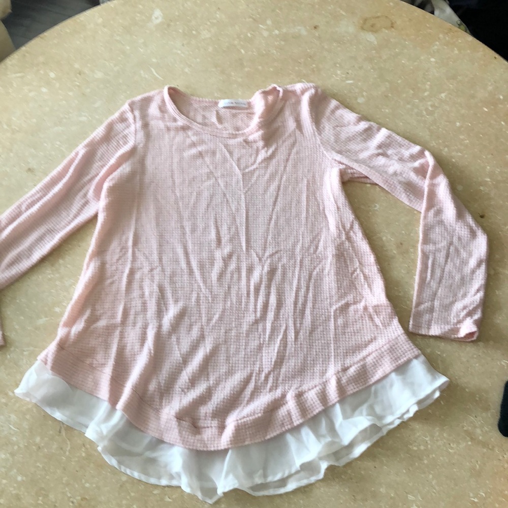 Adorable pink top with ruffle edge on bottom